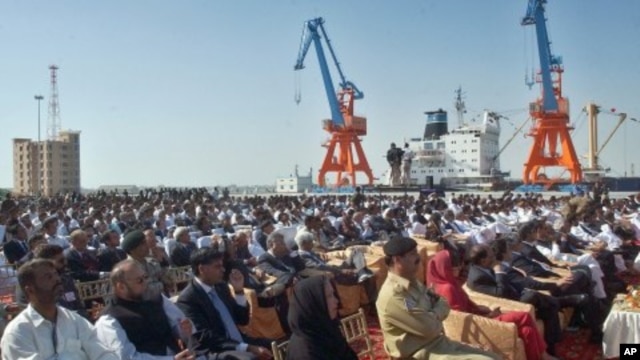 Participants listen to speeches during the opening ceremony of newly built Gwadar port, about 700 kilometers (435 miles) west of Karachi, Pakistan (File Photo - March 20, 2007)
