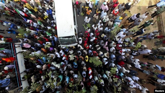 Demonstrators in Abuja protest the elimination of a popular fuel subsidy that has doubled the price of oil in Nigeria, January 11, 2012.