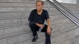 Chalad Vorachat, a retired navy lieutenant and serial hunger striker, sits on the steps of the criminal court in Bangkok, June 10, 2014. 