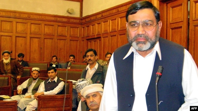 Ikramullah Khan Shahid (R), deputy speaker of a religious parties alliance Muttahida Majlis-e-Amal, pictured in Peshawar, Pakistan, January 1, 2003.