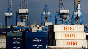 FILE - Empty and disused Islamic Republic of Iran Shipping Lines (IRISL Group) containers are seen at Malta Freeport in the Port of Marsaxlokk outside Valletta, Feb. 10, 2012.  