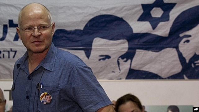 Noam, left, and Aviva Schalit, parents of captured Israeli soldier Gilad Schalit, sit in a protest tent set up outside the Prime Minister's residence in Jerusalem, October 11, 2011.
