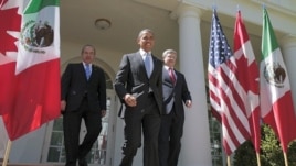 U.S. President Barack Obama, (C), Canada's Prime Minister Stephen Harper (R), and Mexico's President Felipe Calderon (L) walk out of the Oval Office before a joint press conference in the Rose Garden of the White House in Washington, April 2, 2012.