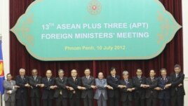 ASEAN countries' foreign ministers join their hands during a photo session at the 45th Association of Southeast Asian Nations (ASEAN) Foreign Ministers' Plus three Meeting in Phnom Penh, Cambodia, Tuesday, July 10, 2012. 