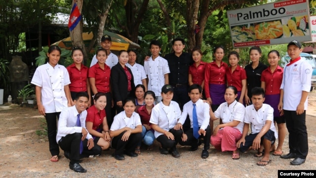 Luon Anchamnes with his employees in front of his Palmboo restaurant in Siem Reap. (Courtesy Photo)