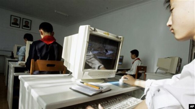 A North Korean teenager learns to use a computer which displays an image of western fighter jets at the Kumsong School, a performing arts and IT-specialist school in Pyongyang, North Korea (FILE).