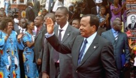 Cameroon's President Paul Biya waves to supporters during the opening of his party conference, in Yaounde, on September 15, 2011.