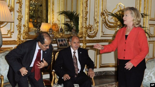 U.S. Secretary of State Hillary Clinton (R), Mustafa Abdel Jalil, chairman of the Libyan National Transitional Council (NTC), and Mahmoud Jibril, the head of Libya's rebel National Transitional Council, attend a bilateral meeting ahead of the "Friends of 
