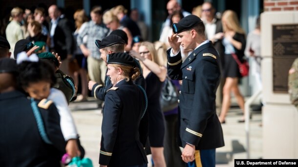 Students from the Infantry Basic Officer Leader Course Class 07-16 celebrate with their families and fellow classmates after graduation, at Fort Benning, Georgia, Oct. 26, 2016.