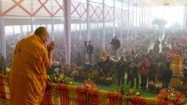 His Holiness the Dalai Lama acknowledging the audience on his arrival for the third day of his teachings in Sarnath, Uttar Pradesh, India, on January 9, 2013. Photo/Tenzin Choejor/OHHDL