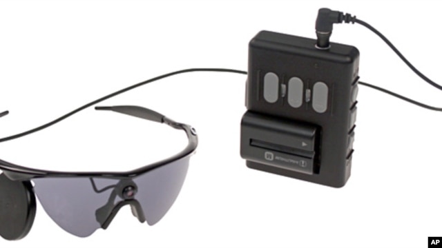 This undated product image provided by Second Sight Medical Products shows a  small video camera and transmitter mounted on a pair of glasses. Images from the camera are processed into electronic data that is wirelessly transmitted to electrodes implanted