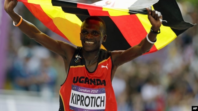 Uganda's Stephen Kiprotich celebrates after crossing the finish line to win gold in the men's marathon at the 2012 Summer Olympics, Aug. 12, 2012, London.