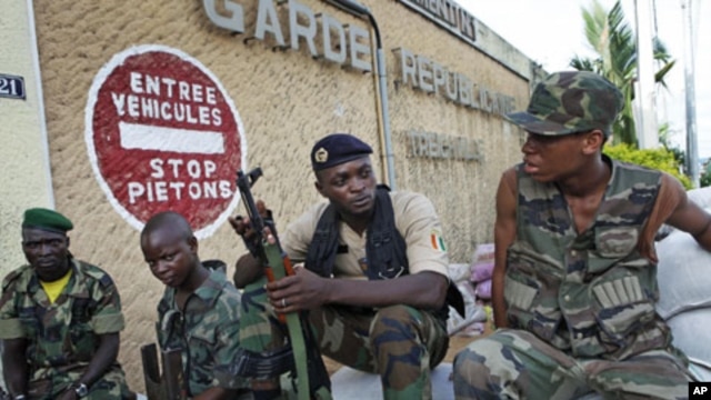 Troops from the Republican Forces of Ivory Coast guard a base in Ivory Coast's main city, Abidjan, April 18, 2011. 