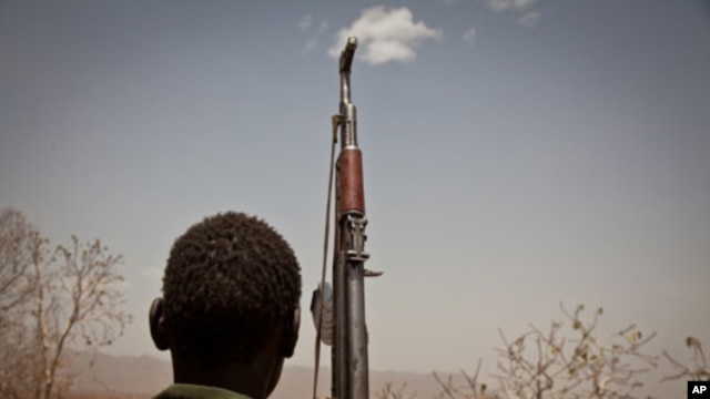 A Sudan People's Liberation Movement (SPLA-N) rebel soldier looks out toward Talodi, in South Kordofan, a region of Sudan, on April 25, 2012