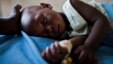 A young girl with malaria rests at a health clinic in the South Sudanese state of Northern Bahr el Ghazal, June 1, 2012.
