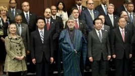 Participants at an international conference on Afghan civilian assistance pose for a group photo at a hotel in Tokyo, July 8, 2012. 