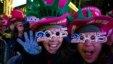 Revelers cheer in Times Square during the New Year's Eve celebration, Wednesday, Dec. 31, 2014.