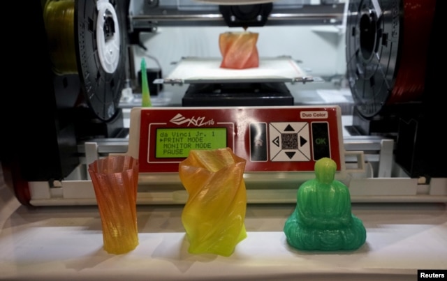 FILE - A 3-D printer for consumers capable of creating multicolor objects is demonstrated at the Consumer Electronics Show in Las Vegas on Jan. 4, 2016.