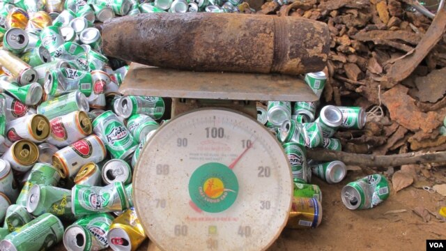 Bomb on scales at scrap yard. (VOA/M. Brown)                          