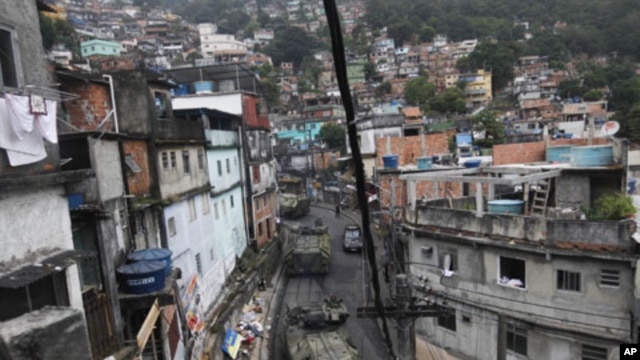 Brazilian navy armored vehicles move into Rocinha shantytown in Rio de Janeiro, Brazil, Nov. 13, 2011.