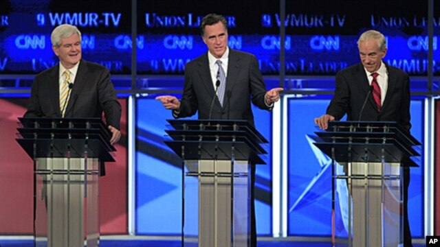Former Massachusetts Governor Mitt Romney answers a question as former House Speaker Newt Gingrich, left, and Representative Ron Paul, listen during the first New Hampshire Republican presidential debate at St. Anselm College in Manchester, New Hampshire,