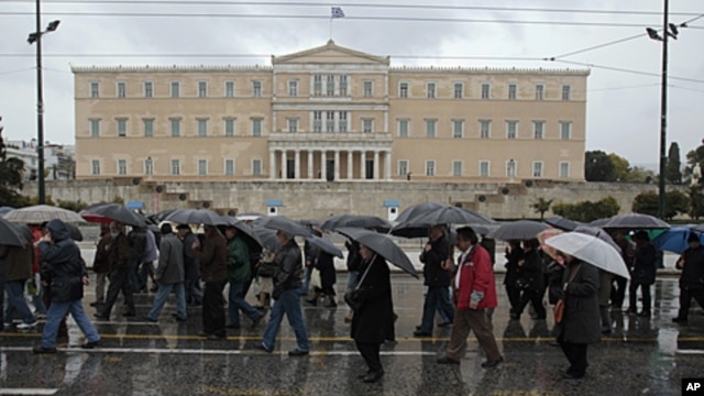 Pensioners march during an anti-austerity rally in front of the parliament in Athens, Greece, February 22, 2012.