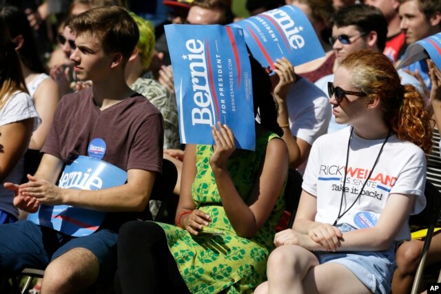 Audience members look on as Democratic presidential candidate, Sen. Bernie Sanders, I-Vt., speaks during a town hall meeting, Sept. 3, 2015, in Grinnell, Iowa.