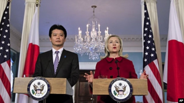 Secretary of State Hillary Clinton (R) speaks during a meeting with Japanese Foreign Minister Koichiro Gemba (L) at the State Department in Washington, December 19, 2011