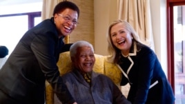 Secretary of State Hillary Rodham Clinton meets with former South Africa President Nelson Mandela and his wife Graca Machel at his home in Qunu, South Africa, Aug. 6, 2012.