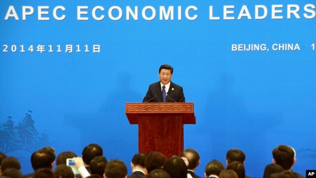 China's President Xi Jinping speaks during a press conference to close the Asia-Pacific Economic Cooperation (APEC) Summit at the International Conference Center in Yanqi Lake, north of Beijing, Nov. 11, 2014.