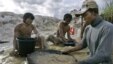 Traditional miners pan for gold at a mine in Hampalit, Central Kalimantan, Indonesia.