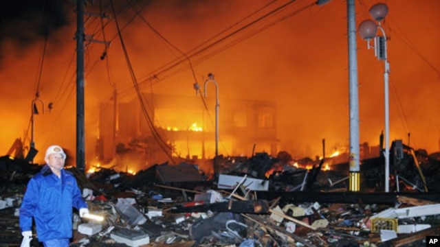 Houses lie flattened after a powerful earthquake in Iwaki, Fukushima Prefecture, Japan, March 11, 2011