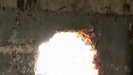 Men's prison in Goma. In the chaos that followed, more than 1,500 men, criminals, escaped from this prison, many of them through this hole in the wall.