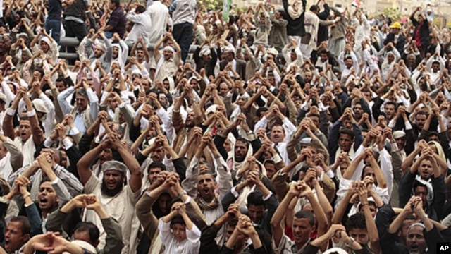 Anti-government protesters shout slogans during a rally after Friday prayers to demand the ouster of Yemen's President Ali Abdullah Saleh in Sana'a, June 24, 2011