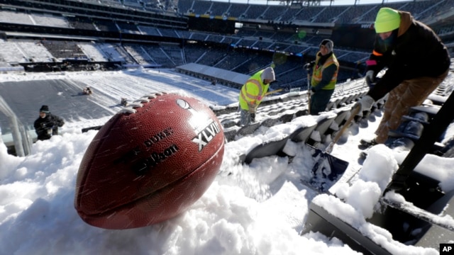 A football with the Super Bowl XLVIII logo after a recent snow at MetLife Stadium in East Rutherford, New Jersey.