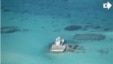 In this photo taken Feb. 28, 2013 by a surveillance plane, and released Thursday, May 15, 2014, by the Philippine Department of Foreign Affairs, Chinese-made structures stands on the Johnson Reef.