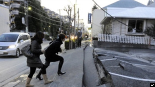 Japan's massive 8.9-magnitude earthquake collapsed a pedestrian road in Urayasu city, Chiba prefecture, Japan, March 11, 2011.