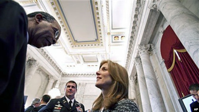 Peace Corps Director Aaron Williams (L) talks with Caroline Kennedy at the reception following a ceremony marking the 50th anniversary of President John F. Kennedy's inaugural address about the Peace Corps, on Capitol Hill in Washington, DC, January 20, 2