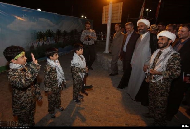 This photo posted on Iran's state-run news agency site IRNA purportedly shows a child going through a training session on how to use firearms.