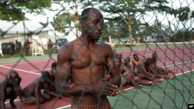 Pro-Gbagbo militiamen are pictured after their capture  in Abidjan, April 11, 2011