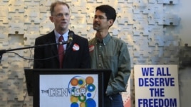 (L-R) Same-sex marriage advocate John Lewis and Stuart Gaffney speak during a celebratory toast to Obama's support of same-sex marriage in San Francisco, California, May 9, 2012.