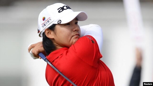 Yani Tseng of Taiwan hits her tee shot on the second hole during the second round of the British Women's Open Golf tournament at Royal Liverpool Golf Club, northern England, September 15, 2012.