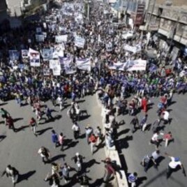 Yemeni protestors march during a demonstration denouncing the immunity law passed for Yemen's President Ali Abdullah Saleh in Sanaa, Yemen, January 22, 2012.