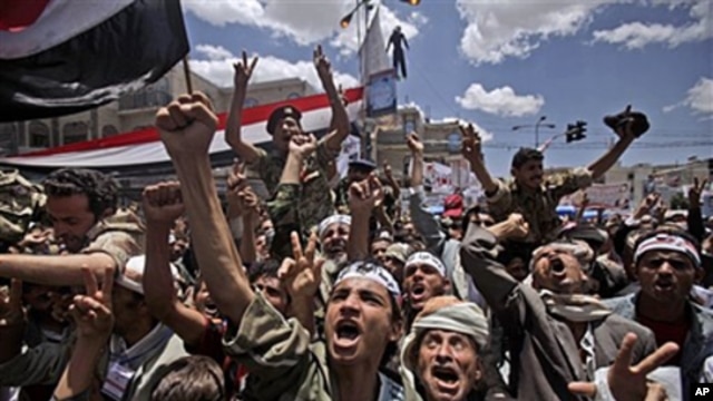 Anti-government protesters shout slogans during a demonstration demanding the resignation of Yemeni President Ali Abdullah Saleh, in Sana'a, Yemen, April 25, 2011