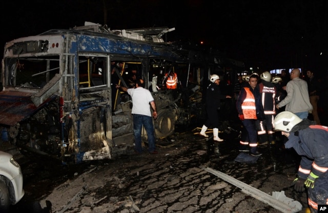 Members of emergency services work at the scene of an explosion in Ankara, Turkey, Sunday, March 13, 2016.