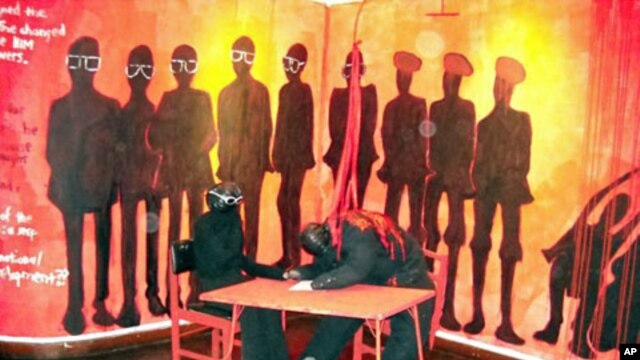 "Signing the unity accord:" In 1987, after years of violence against supporters, Joshua Nkomo (Zimbabwe African People�s Union, ZAPU) signed an accord for a unity government with Mr Mugabe.  Maseko depicts this moment with blood pouring onto Nkomo's cowed