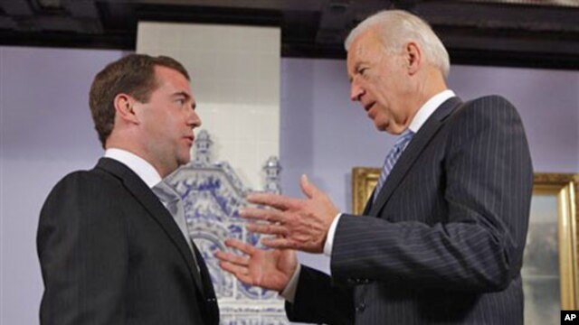 Vice President of the United States Joe Biden, right, speaks to Russian President Dmitry Medvedev during their meeting at the Gorky presidential residence outside Moscow, March 9, 2011