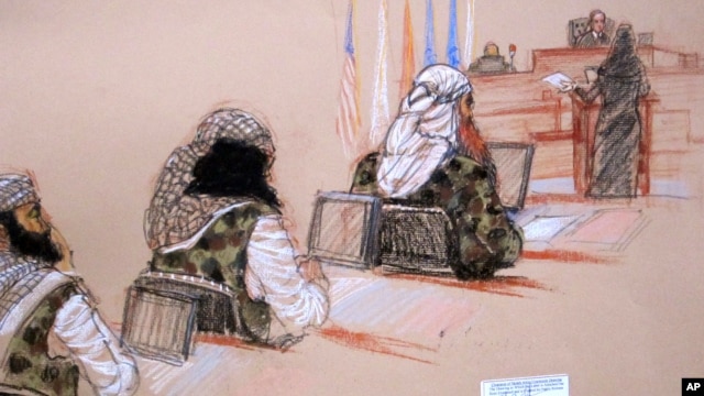 In this pool photo of a sketch by courtroom artist Janet Hamlin and reviewed by the U.S. Department of Defense, three of the five Sept. 11 defendants, from left, Ramzi Binalshibh, Walid bin Attash and the self-proclaimed terrorist mastermind Khalid Sheikh