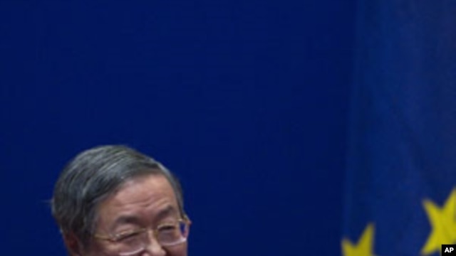 China's Central Bank Governor Zhou Xiaochuan reacts after European Commission President Jose Manuel Barroso gave a speech on the euro at the University of International Business and Economics in Beijing, China, Feb. 15, 2012.
