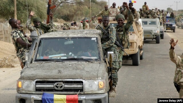 Chadian soldiers escorting a group of journalists ride on trucks and pickups in the Nigerian city of Damasak, Nigeria, March 18, 2015.